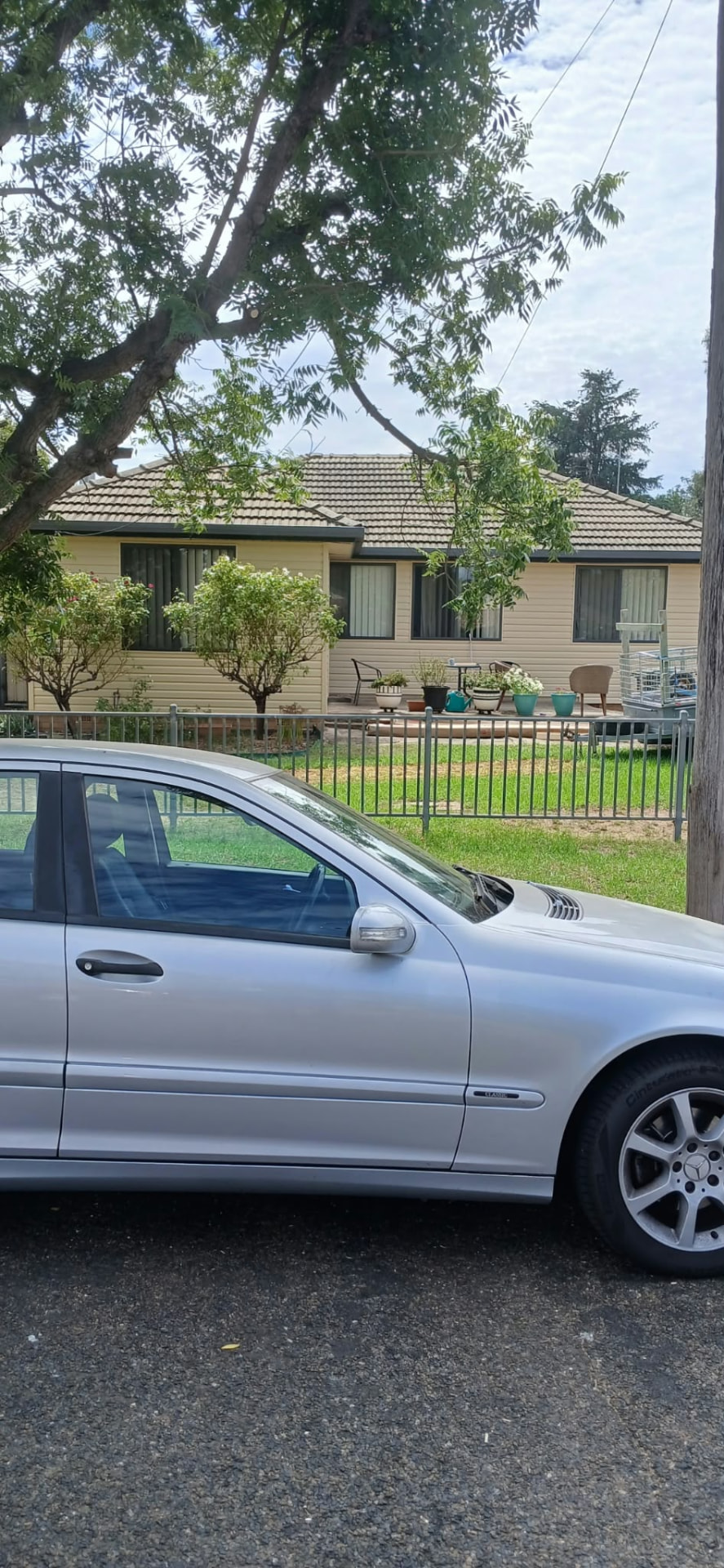 Finished cream clad home viewed from the street
